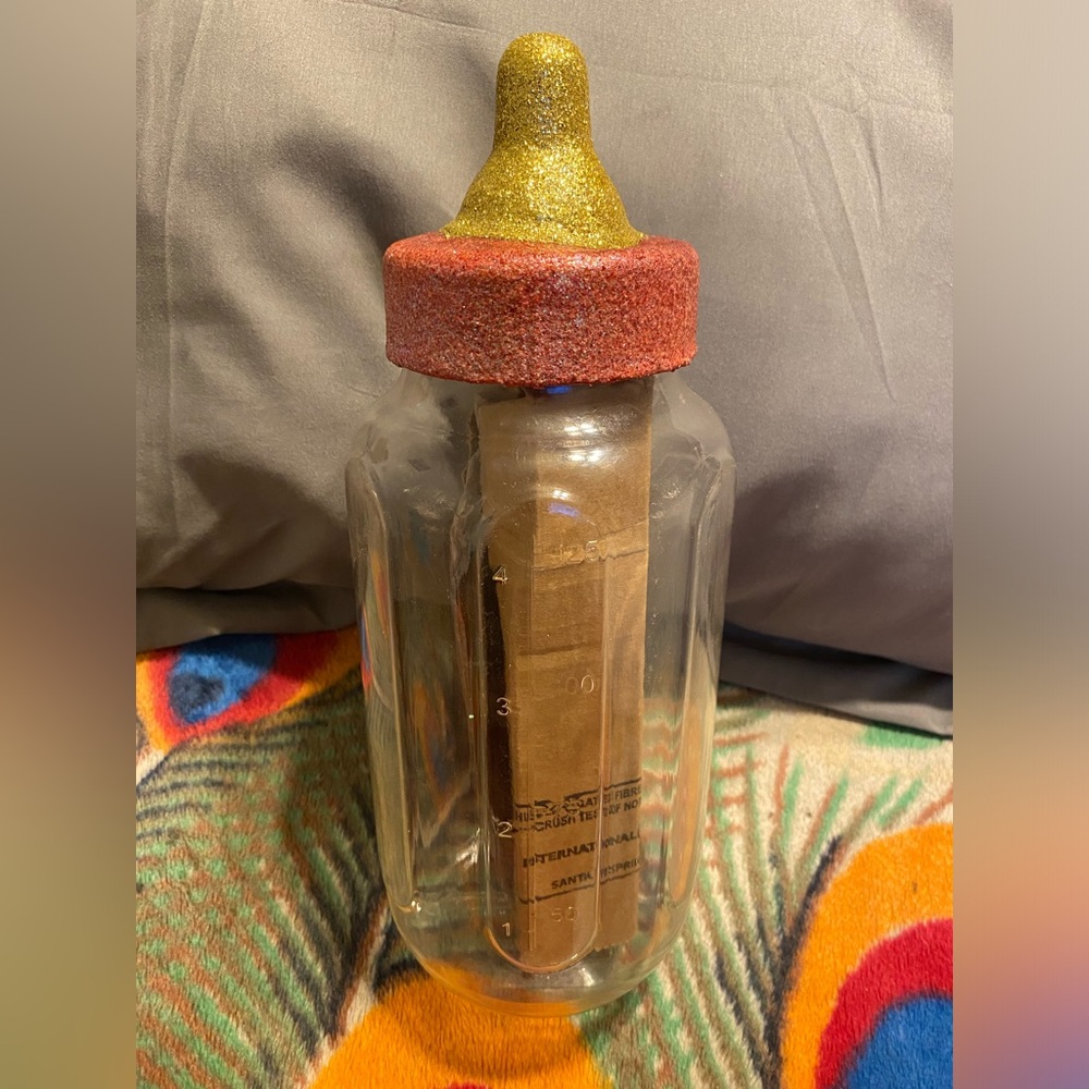 Red and Gold Oversized Plastic Baby Bottle Decor